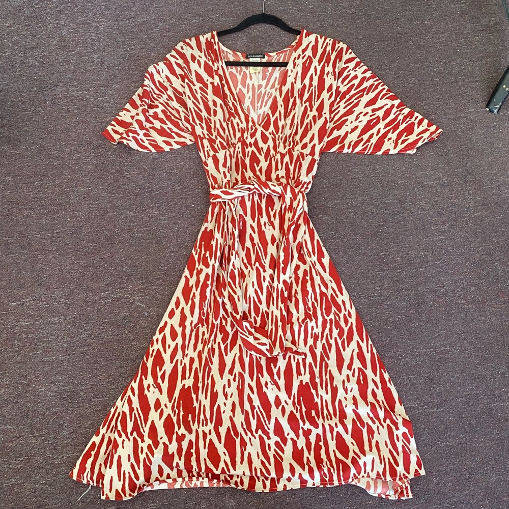 Printed Wrap Dress. Size S/M size 4-8 can wear this wrap dress.